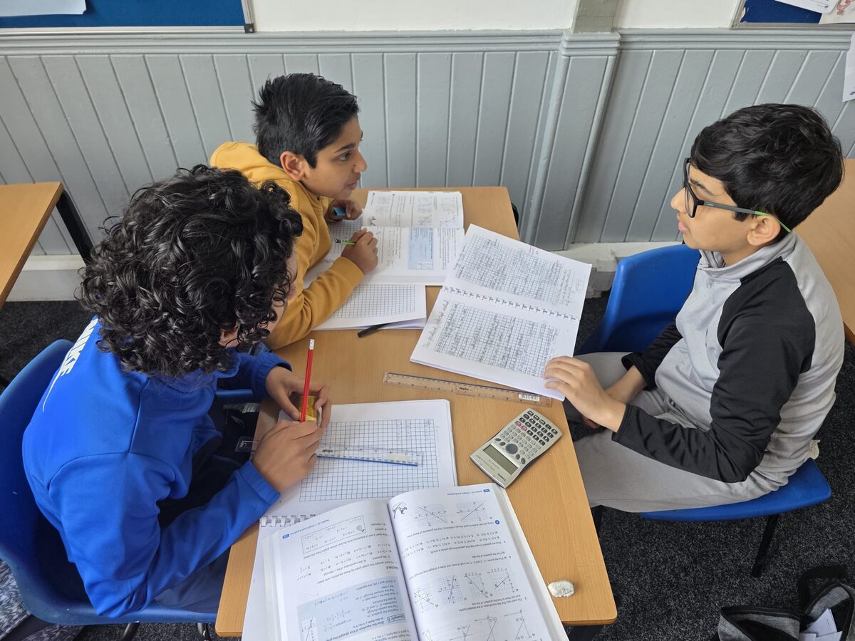 Two students working through maths together