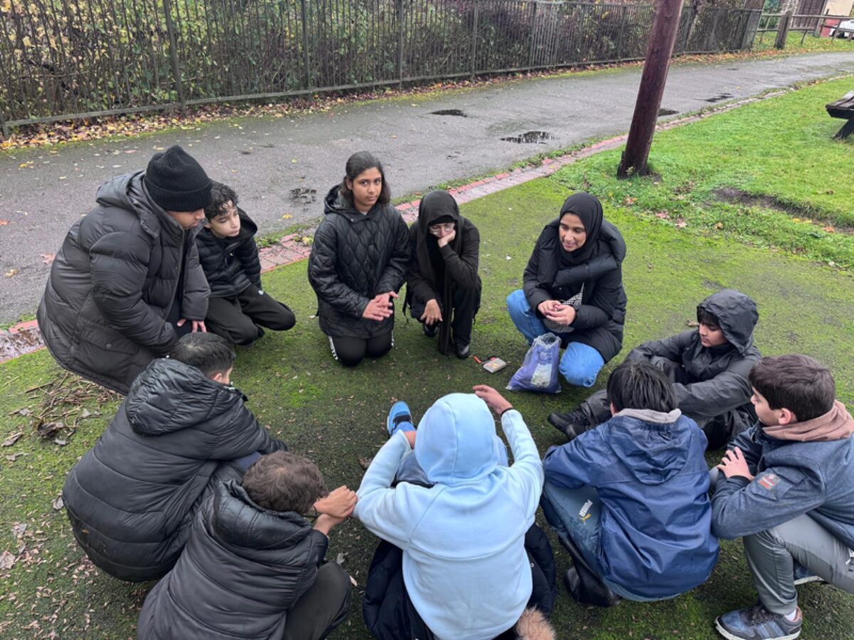 Students in a discussion circle outdoors
