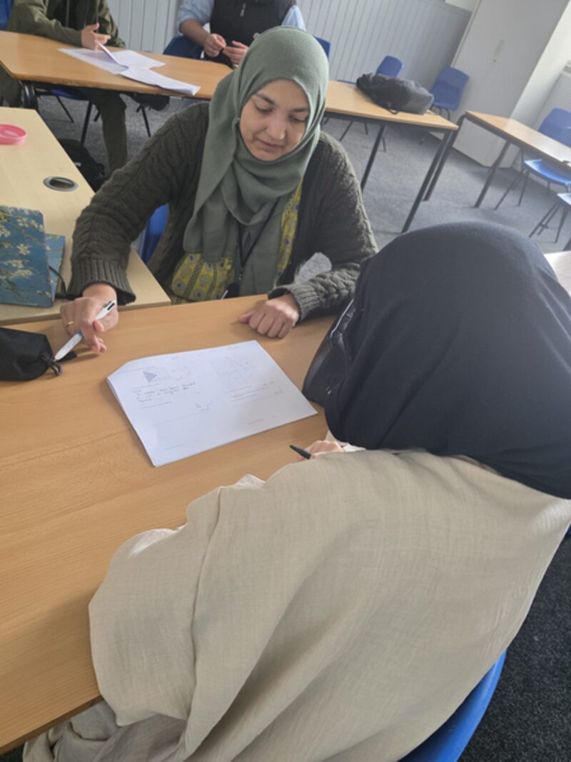 Miss Azba, Beyond 16 and Maths teacher, working with a student